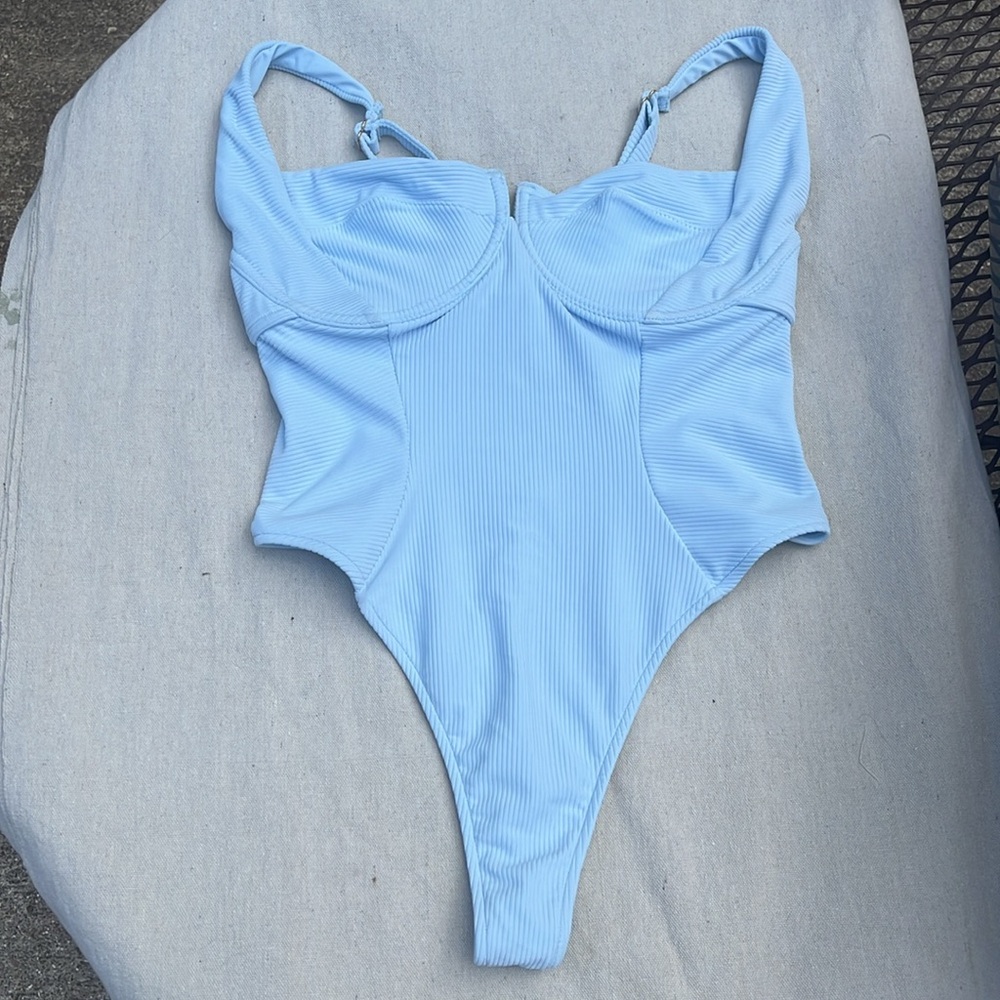 Camille Kostek She’s Iconic Light Blue Thong Onepiece Swim